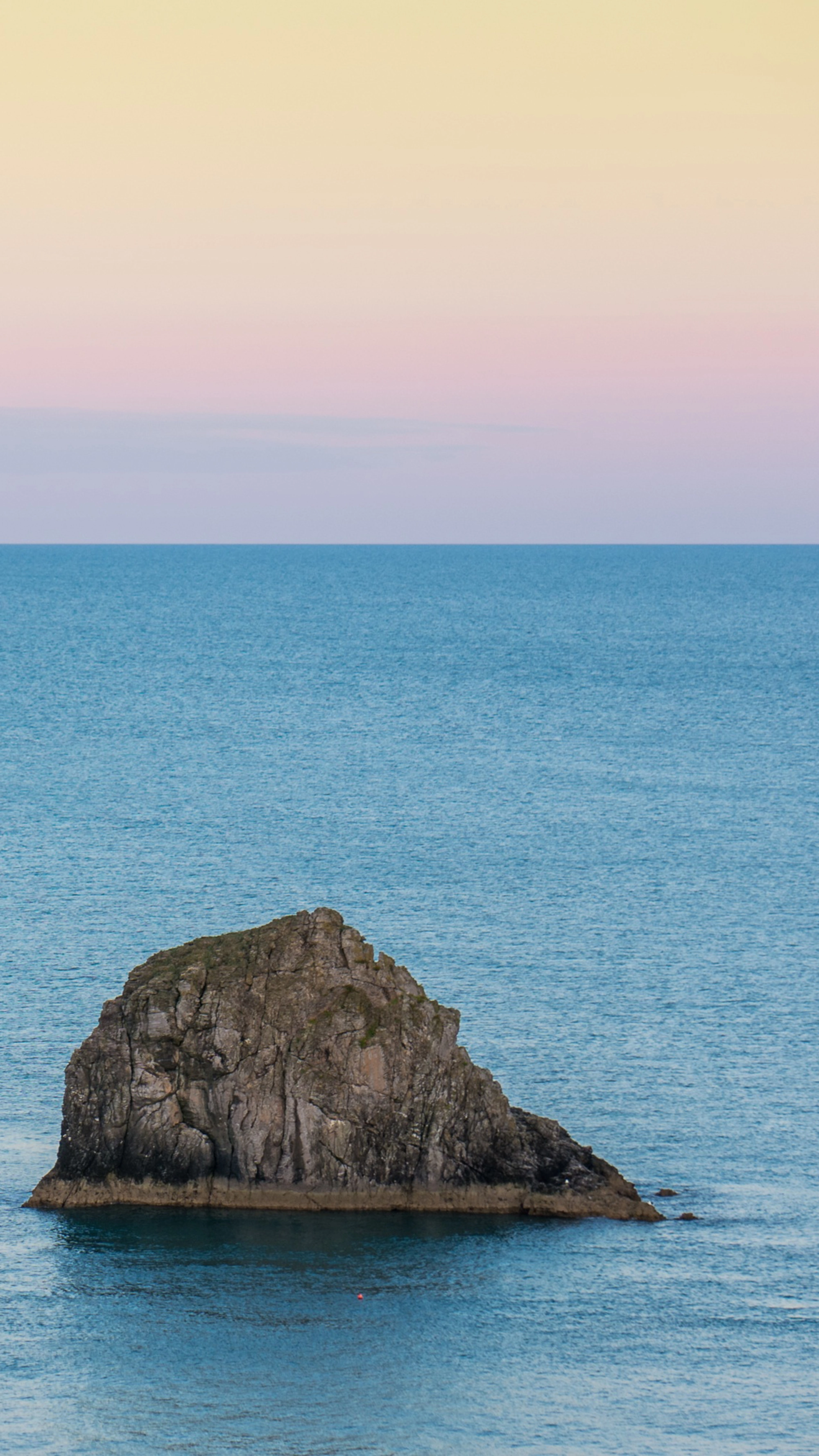 lone rock in the water