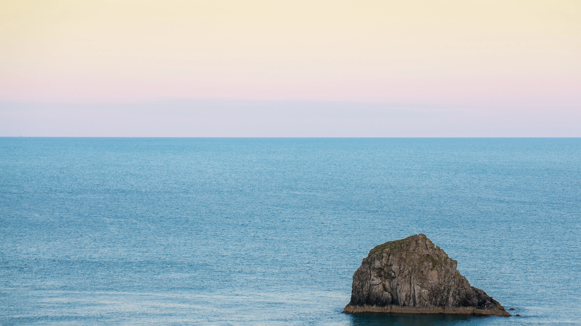 lone rock in the water